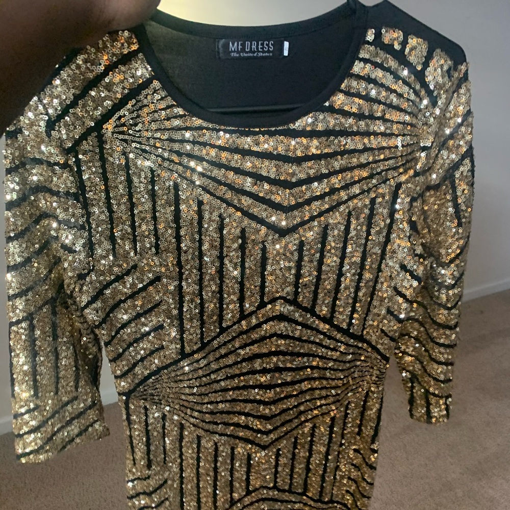 A black and gold  Sequin dinner dress